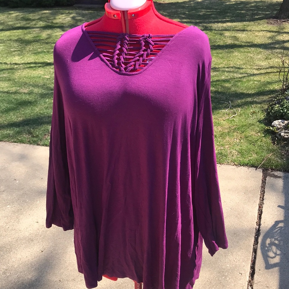 Purple knit top with braided accent o neck area